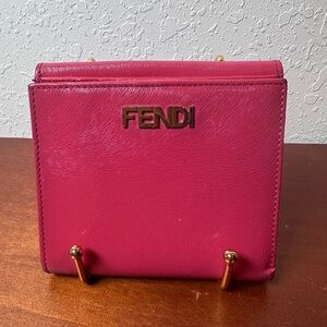 Fendi pink pendant wallet.